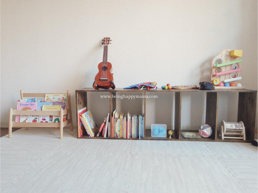 A tidy Montessori shelf with low and accessible open shelf.